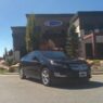 Bulletproof Chevy Volt in front of Armormax Utah facility