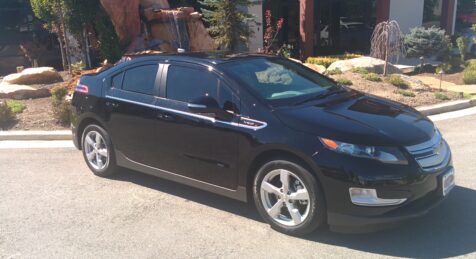 Bulletproof Chevy Volt in front of Armormax Utah facility