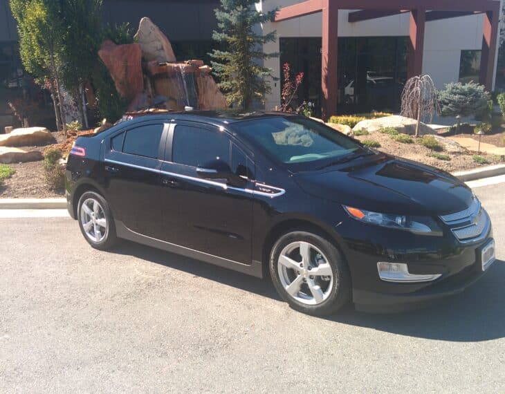 Bulletproof Chevy Volt in front of Armormax Utah facility